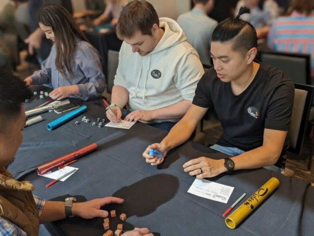 group of millennial professionals engaging in a dice assessment